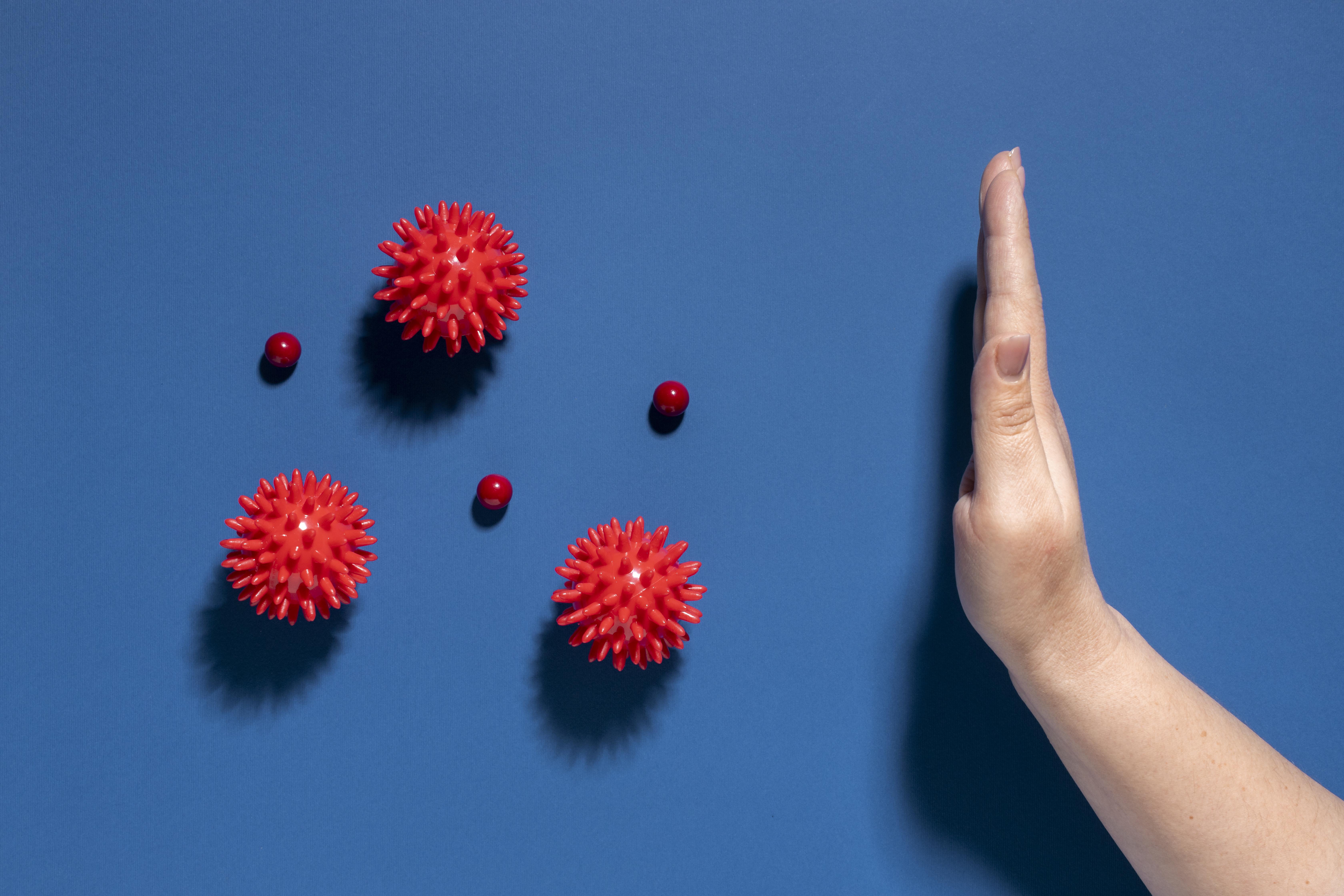 Flat lay hand stopping viruses